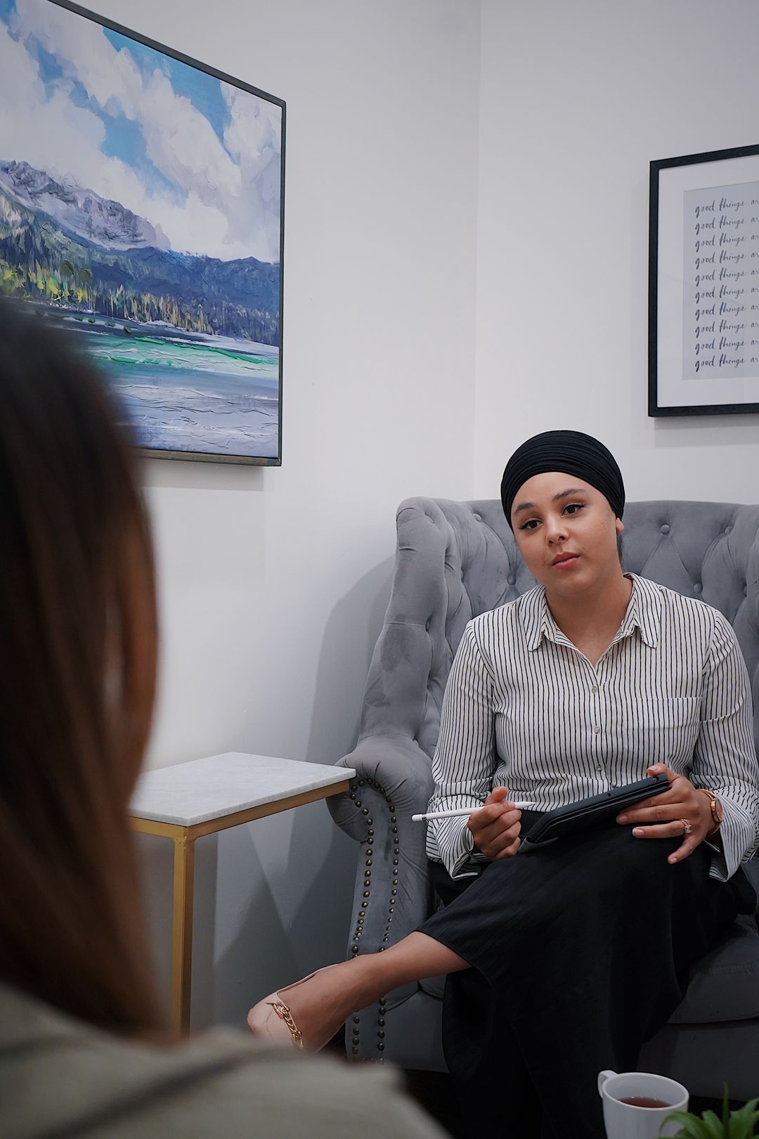 A resource navigator meeting one-on-one with a veteran in a calm office