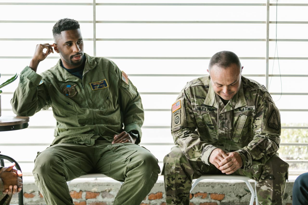 Two veterans in a quiet, supportive conversation
